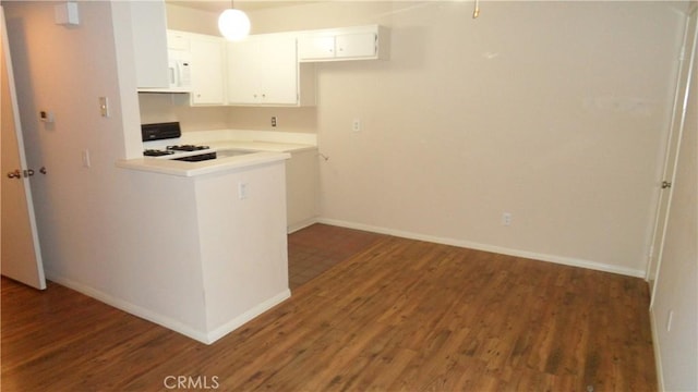 kitchen featuring range, dark hardwood / wood-style flooring, and white cabinets