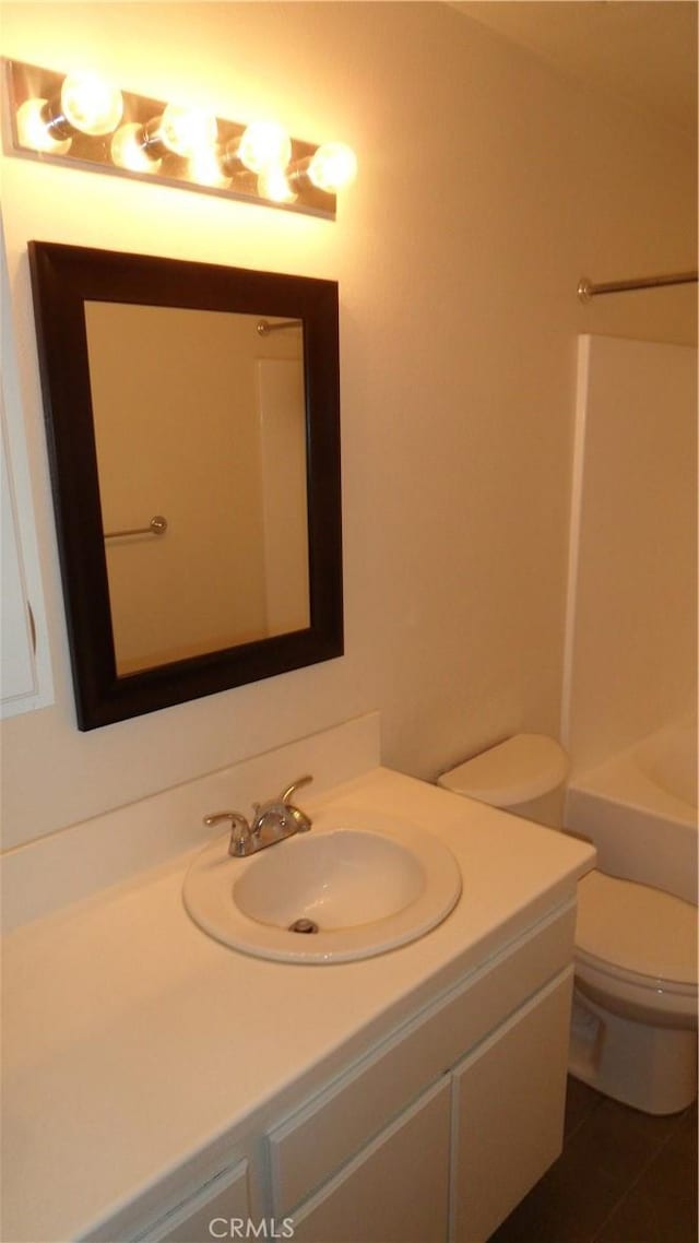 bathroom featuring vanity and toilet