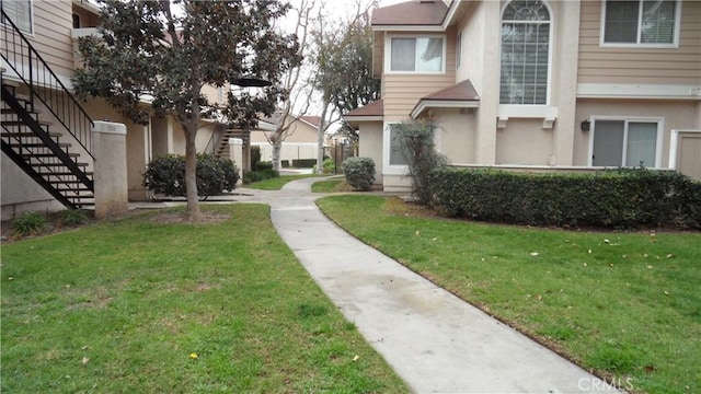 surrounding community featuring a yard