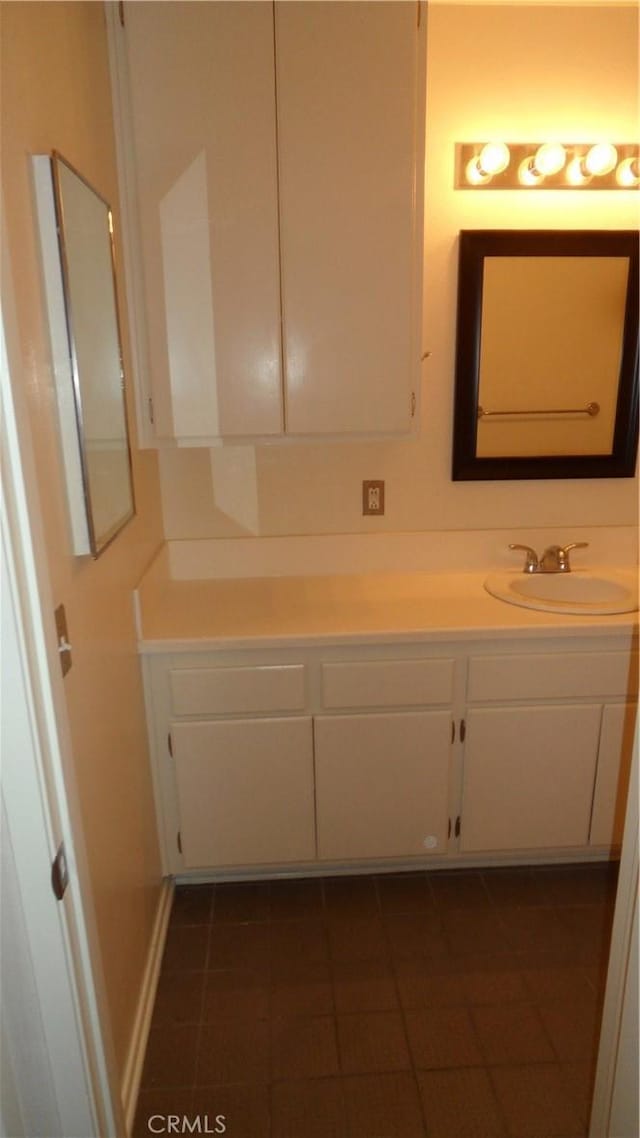 bathroom with tile patterned floors and vanity