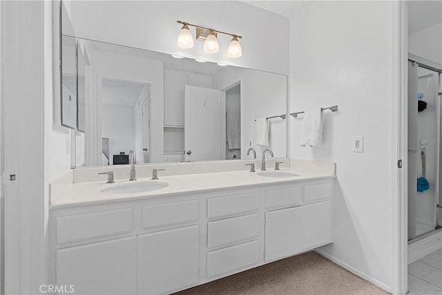 bathroom featuring vanity and an enclosed shower