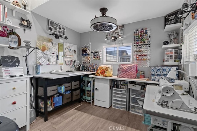 kitchen with white cabinetry, light hardwood / wood-style flooring, and a healthy amount of sunlight