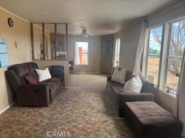 carpeted living room with ceiling fan