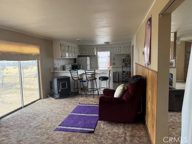 carpeted living room with a wealth of natural light