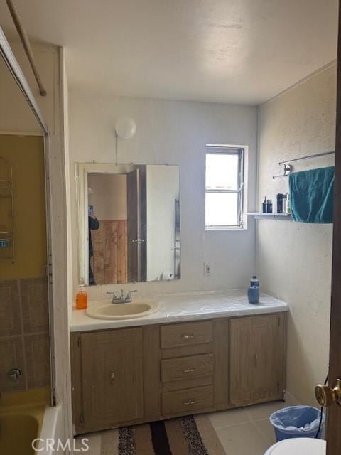 full bathroom with vanity, bathtub / shower combination, tile patterned floors, and toilet