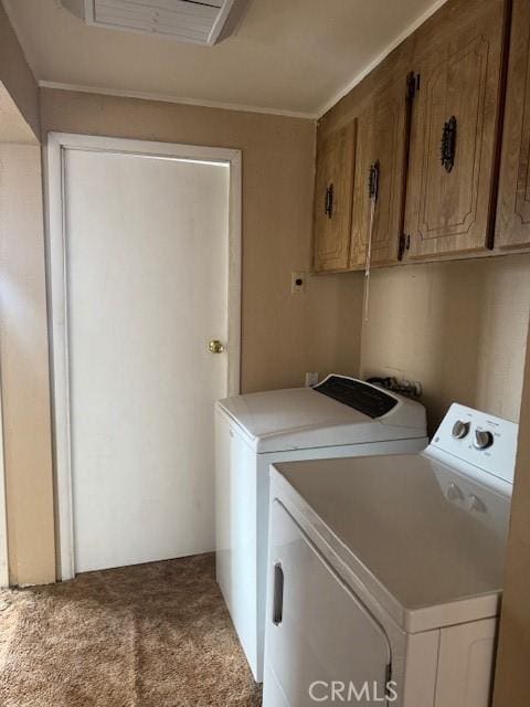 washroom featuring cabinets, separate washer and dryer, and carpet