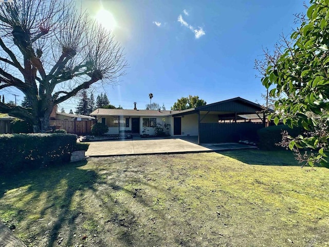 single story home with a patio area and a front yard