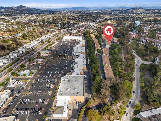 birds eye view of property featuring a mountain view