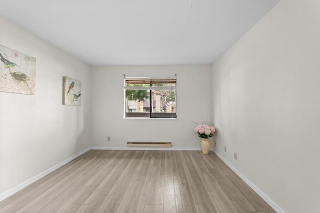 unfurnished room with light hardwood / wood-style flooring