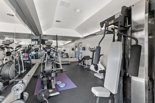 gym with vaulted ceiling