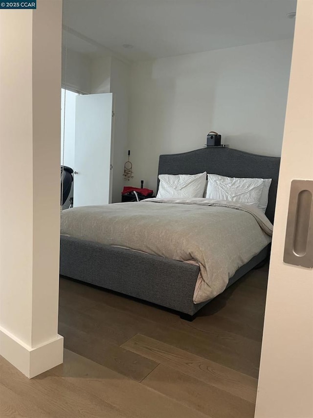 bedroom featuring hardwood / wood-style flooring