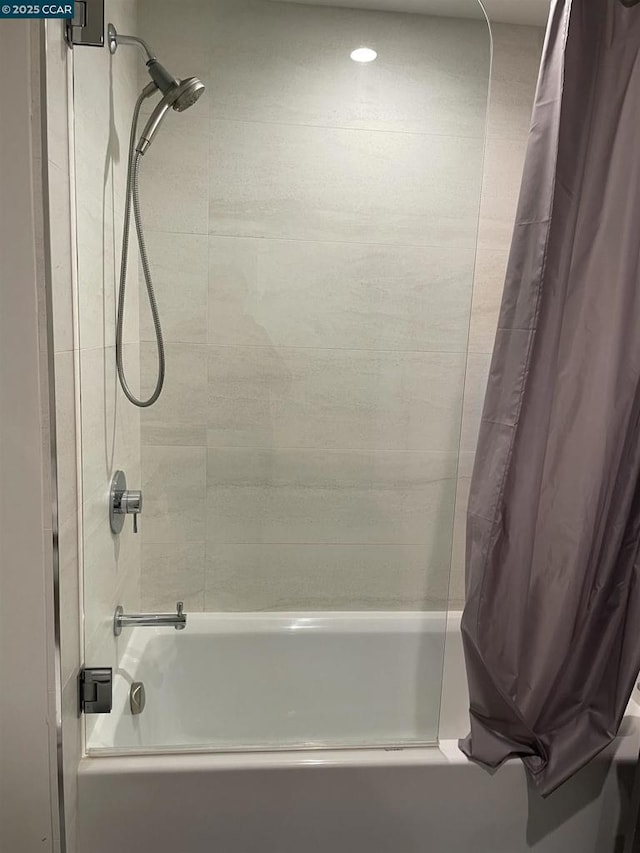 bathroom featuring shower / bathtub combination with curtain