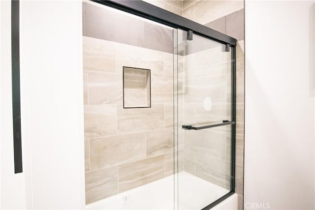 bathroom featuring enclosed tub / shower combo