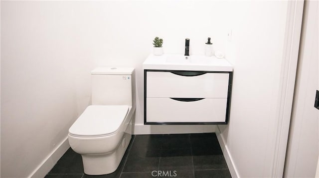 bathroom with tile patterned floors, toilet, and vanity