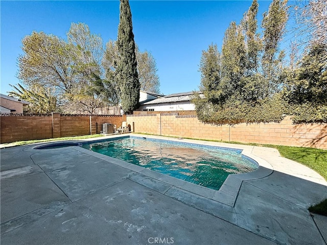 view of swimming pool featuring central AC unit and a patio area