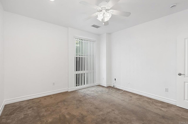 empty room with visible vents, ceiling fan, baseboards, and carpet