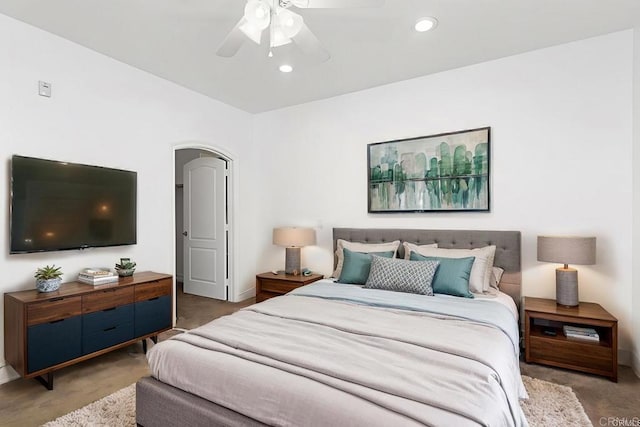 bedroom featuring arched walkways, recessed lighting, ceiling fan, and carpet floors