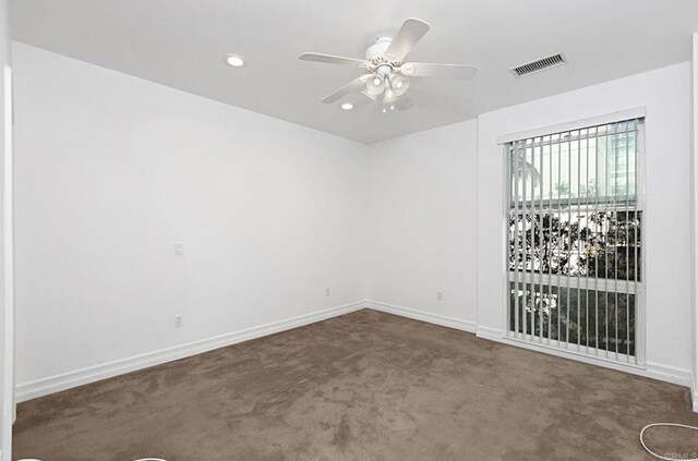 spare room with visible vents, ceiling fan, baseboards, carpet floors, and recessed lighting