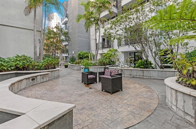 view of home's community featuring an outdoor living space and a patio area