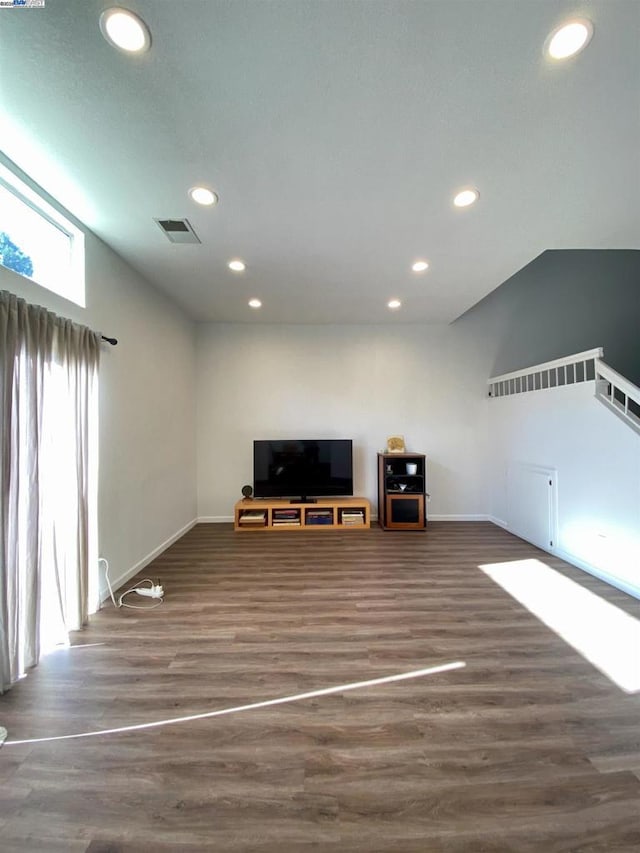 unfurnished living room featuring dark hardwood / wood-style floors