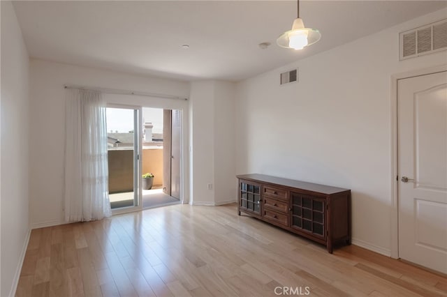 spare room featuring light hardwood / wood-style flooring