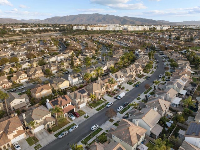 birds eye view of property featuring a mountain view