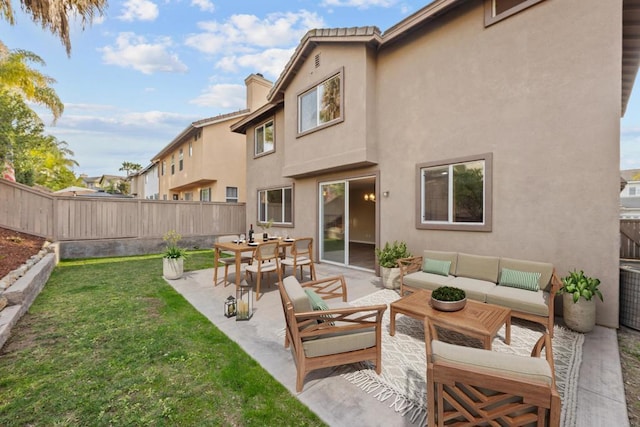 back of house with a yard, an outdoor hangout area, and a patio area