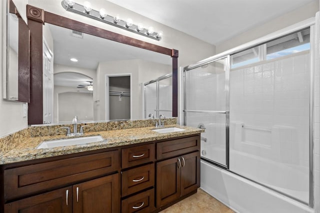 bathroom with enclosed tub / shower combo, tile patterned floors, vanity, and ceiling fan