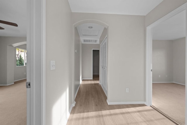 hallway with light carpet