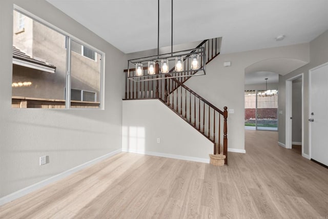 unfurnished living room featuring light hardwood / wood-style floors