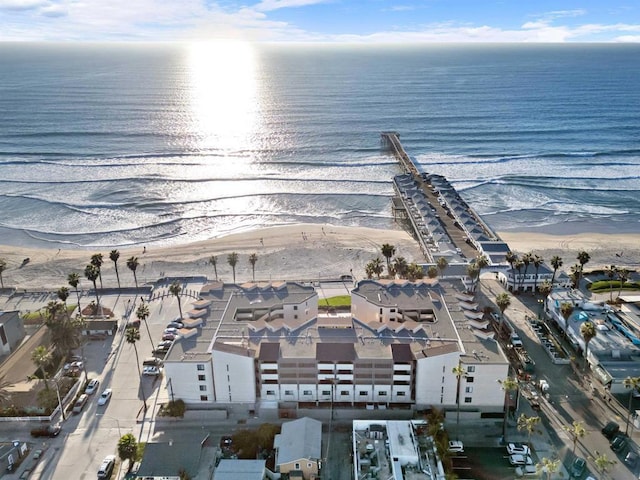 bird's eye view featuring a water view and a view of the beach