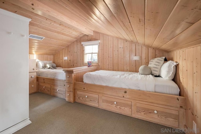 bedroom featuring lofted ceiling, carpet floors, wood ceiling, and wooden walls