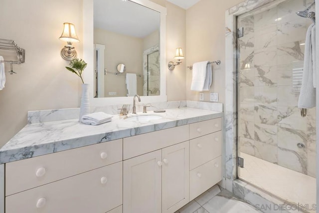 bathroom featuring vanity and an enclosed shower