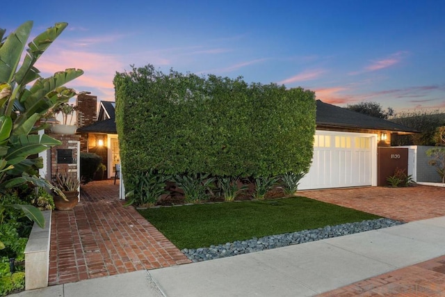 obstructed view of property featuring a garage