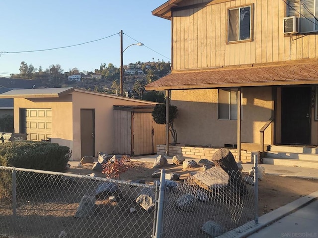 view of side of home featuring cooling unit