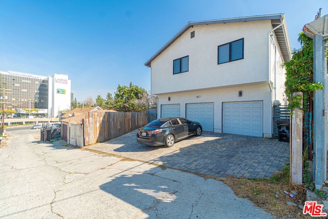 view of side of home with a garage