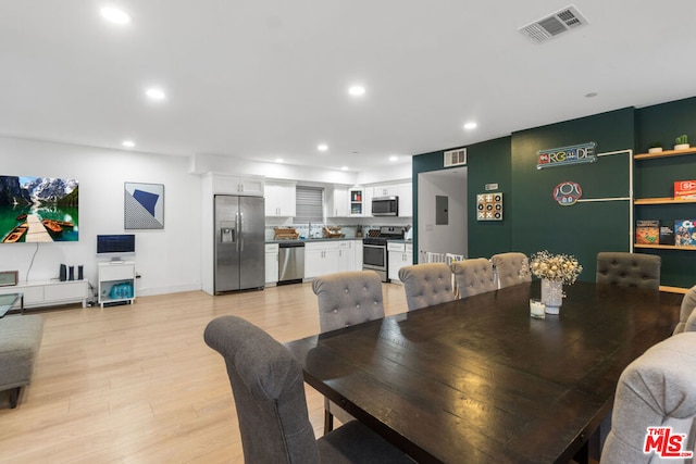 dining room with light hardwood / wood-style floors