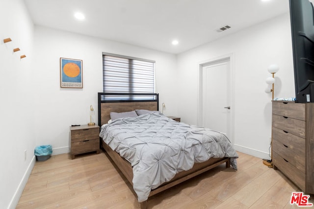 bedroom with light wood-type flooring