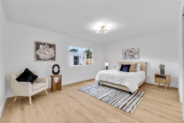 bedroom with light hardwood / wood-style floors