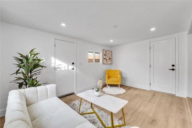 living area with light hardwood / wood-style floors