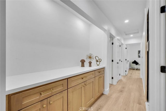 hallway with light hardwood / wood-style flooring