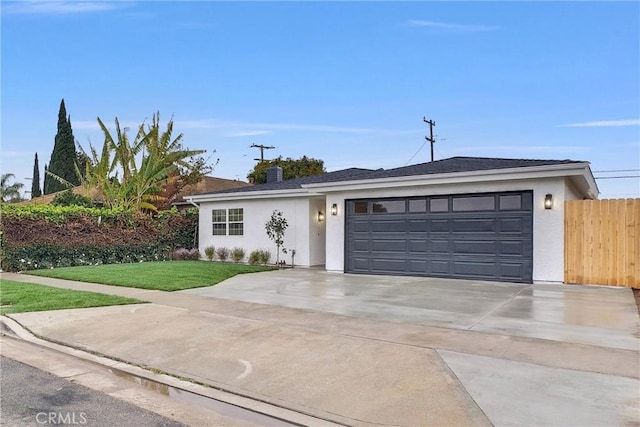 ranch-style house with a garage and a front lawn