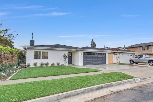 ranch-style house with a garage and a front yard