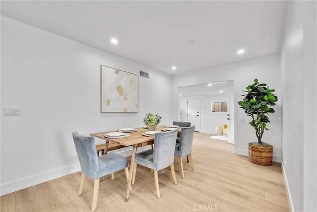 dining room featuring light hardwood / wood-style floors