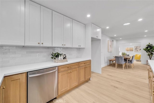 kitchen featuring light brown cabinetry, white cabinetry, tasteful backsplash, light hardwood / wood-style flooring, and dishwasher