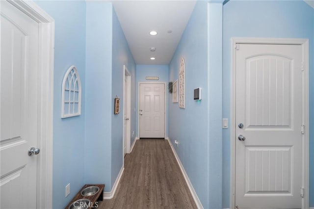 corridor with dark hardwood / wood-style floors