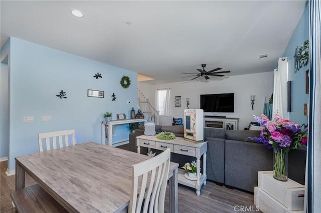 dining space featuring hardwood / wood-style floors and ceiling fan