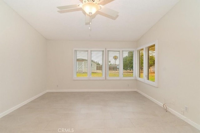 spare room featuring ceiling fan and lofted ceiling