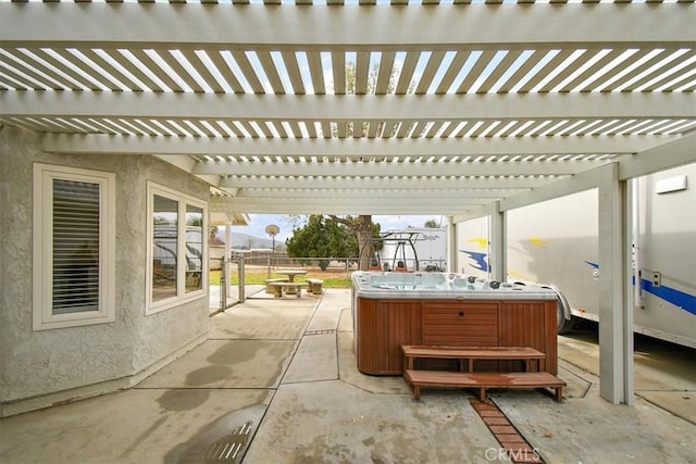 view of patio featuring a pergola and a hot tub