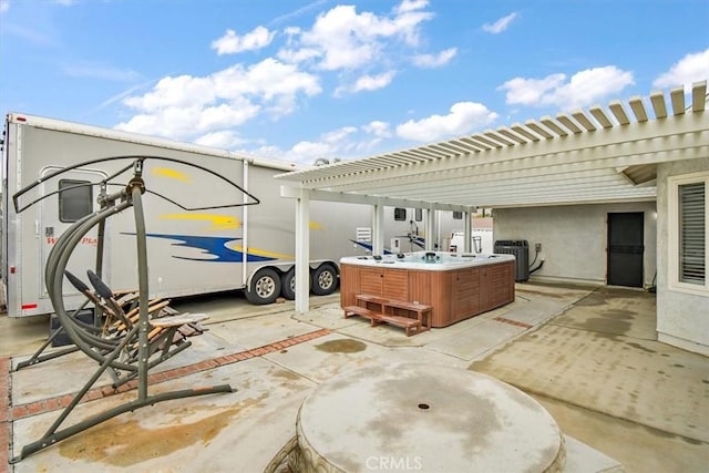 view of patio / terrace featuring a hot tub, a pergola, and central air condition unit